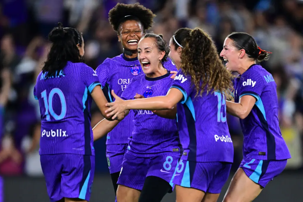 Orlando Pride teammates celebrate a goal from midfielder Luana during the 2025 NWSL Playoffs.