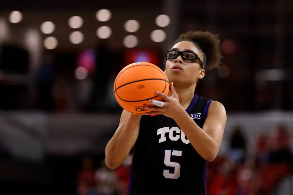 TCU basketball star Olivia Miles preps a free throw during a 2025/26 NCAA game.