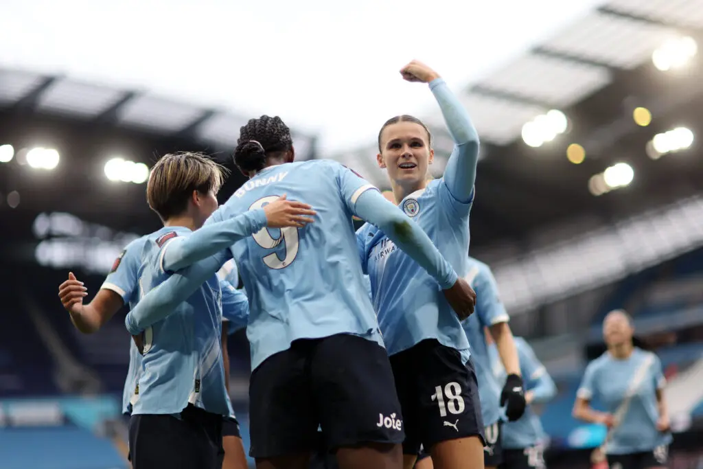 Manchester City defender Kerstin Casparij celebrates a goal by forward Khadija "Bunny" Shaw during the club's 3-0 defeat of WSL rival Manchester United.