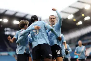 Manchester City defender Kerstin Casparij celebrates a goal by forward Khadija "Bunny" Shaw during the club's 3-0 defeat of WSL rival Manchester United.