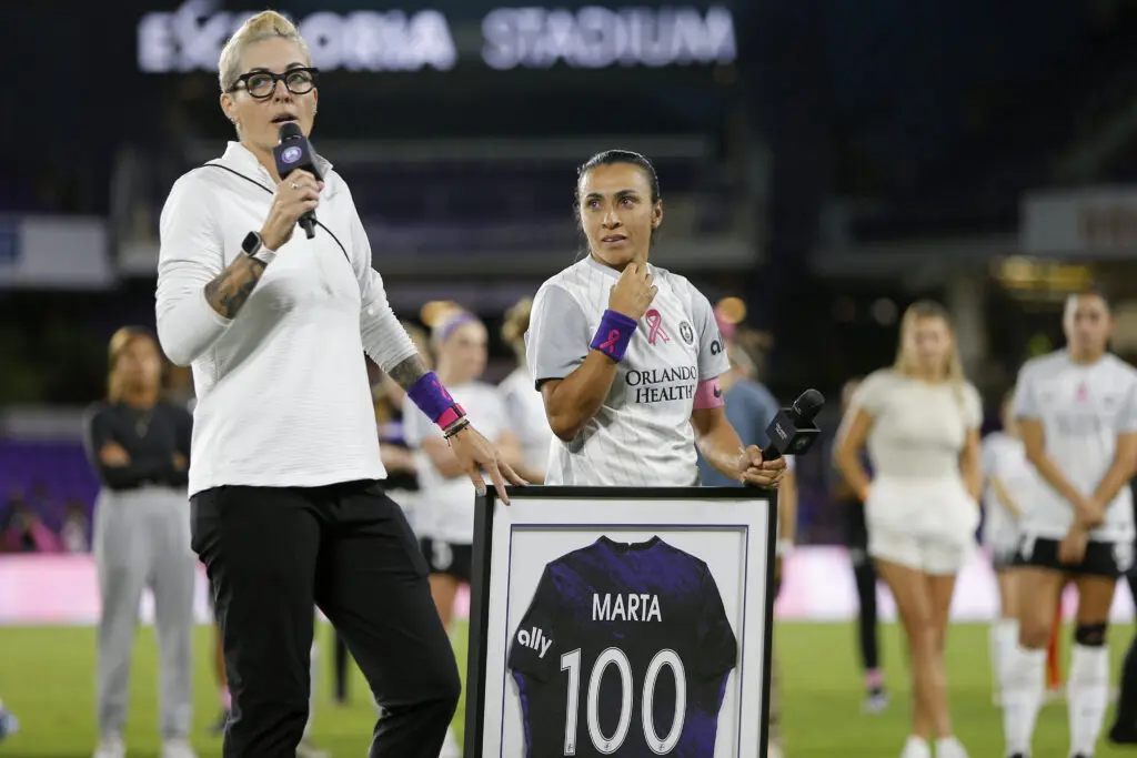 Orlando Pride sporting director Haley Carter speaks to the crowd during a ceremony honoring 100 home games for star attacker Marta.
