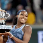US tennis star Coco Gauff poses holding her 2025 French Open trophy ahead of her 2026 Roland Garros title defense.