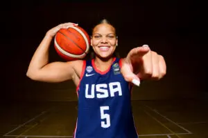 Team USA guard Jerzy Robinson poses with a basketball ahead of a 2025 FIBA U-19 tournament.