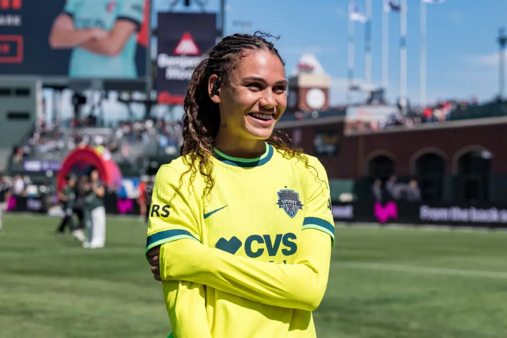 Washington Spirit forward Trinity Rodman smiles after a 2025 NWSL match.