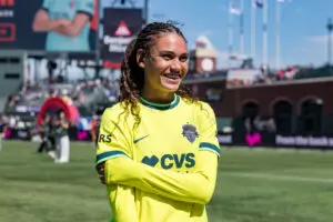 Washington Spirit forward Trinity Rodman smiles after a 2025 NWSL match.