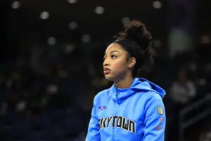 Chicago Sky star Angel Reese looks on before a 2025 WNBA game.