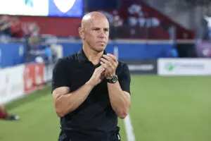 Colorado Rapids head coach Chris Armas claps on the sideline of a 2025 MLS match.