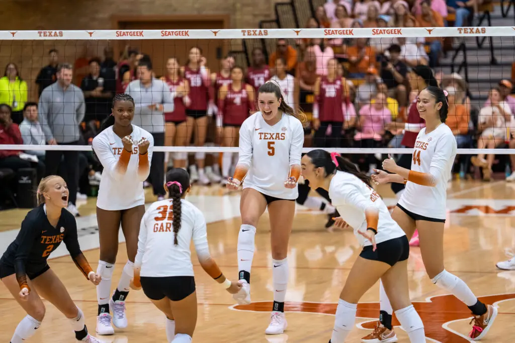 Texas volleyball celebrates a point during a 2025 NCAA game against Red River Rivalry foe Oklahoma.