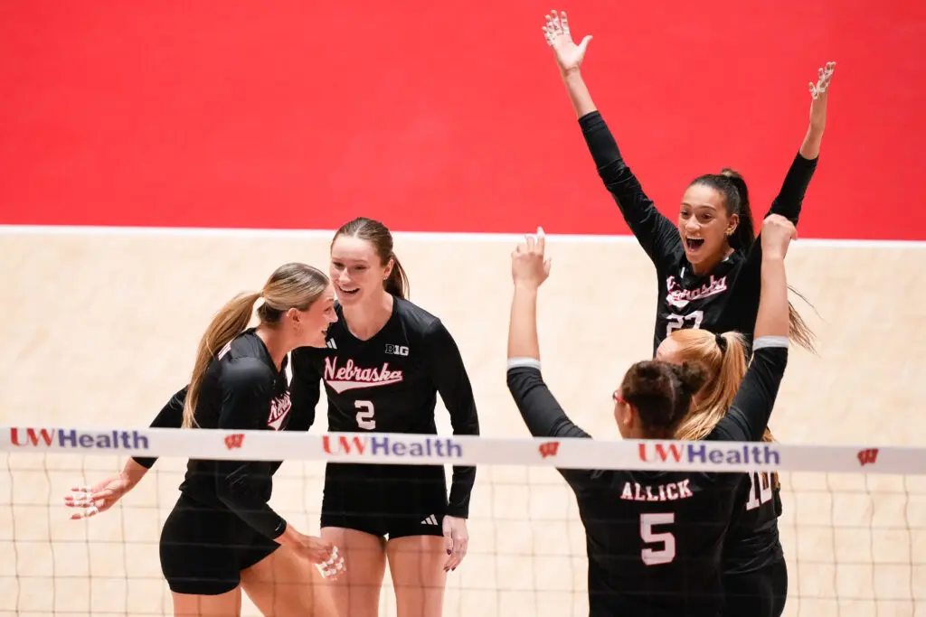 Nebraska teammates Andi Jackson, Bergen Reilly, Rebekah Allick, Olivia Mauch, and Harper Murray celebrate a point during a 2025 NCAA volleyball game.