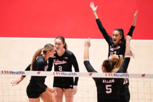Nebraska teammates Andi Jackson, Bergen Reilly, Rebekah Allick, Olivia Mauch, and Harper Murray celebrate a point during a 2025 NCAA volleyball game.