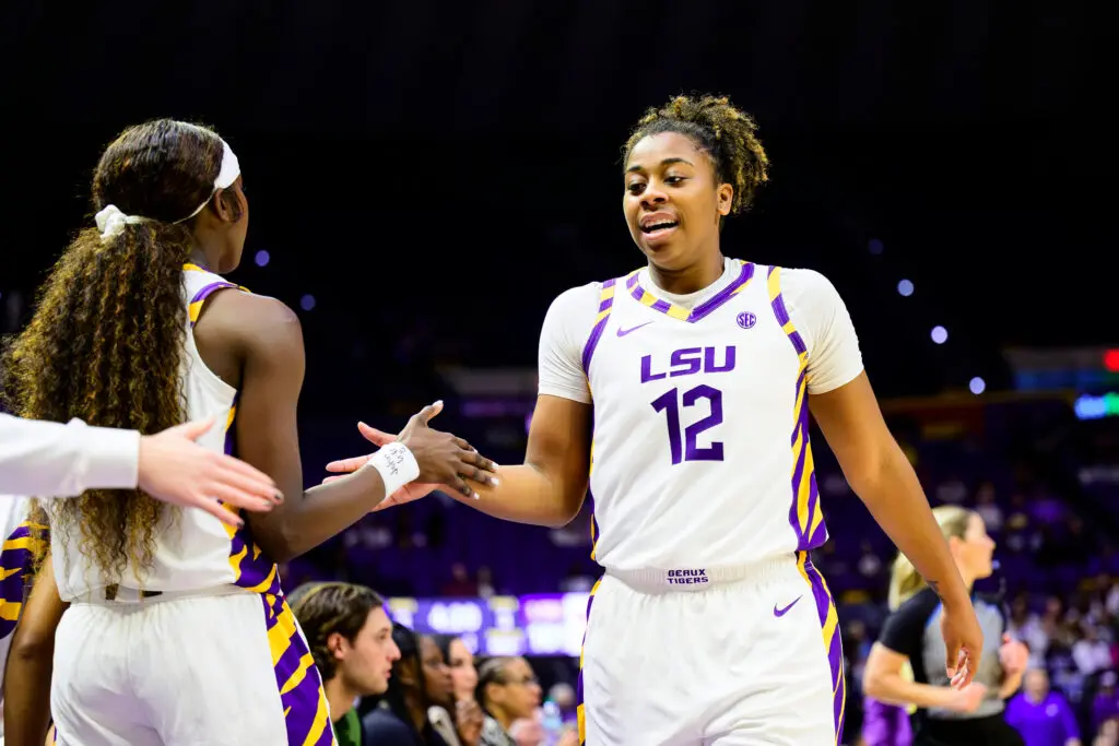 LSU guard Mikaylah Williams high-fives Flau'jae Johnson during a 2025/26 NCAA basketball game.