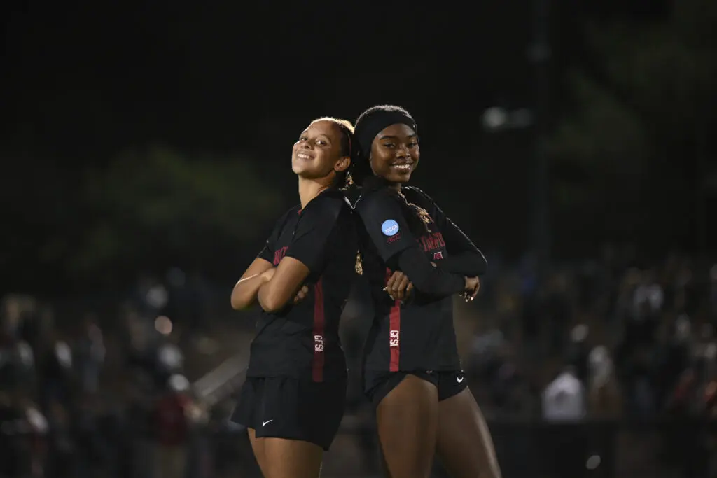 Stanford defender Lizzie Boamah and midfielder Jasmine Aikey pose for a photo after a 2025 NCAA soccer tournament win.