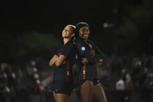 Stanford defender Lizzie Boamah and midfielder Jasmine Aikey pose for a photo after a 2025 NCAA soccer tournament win.