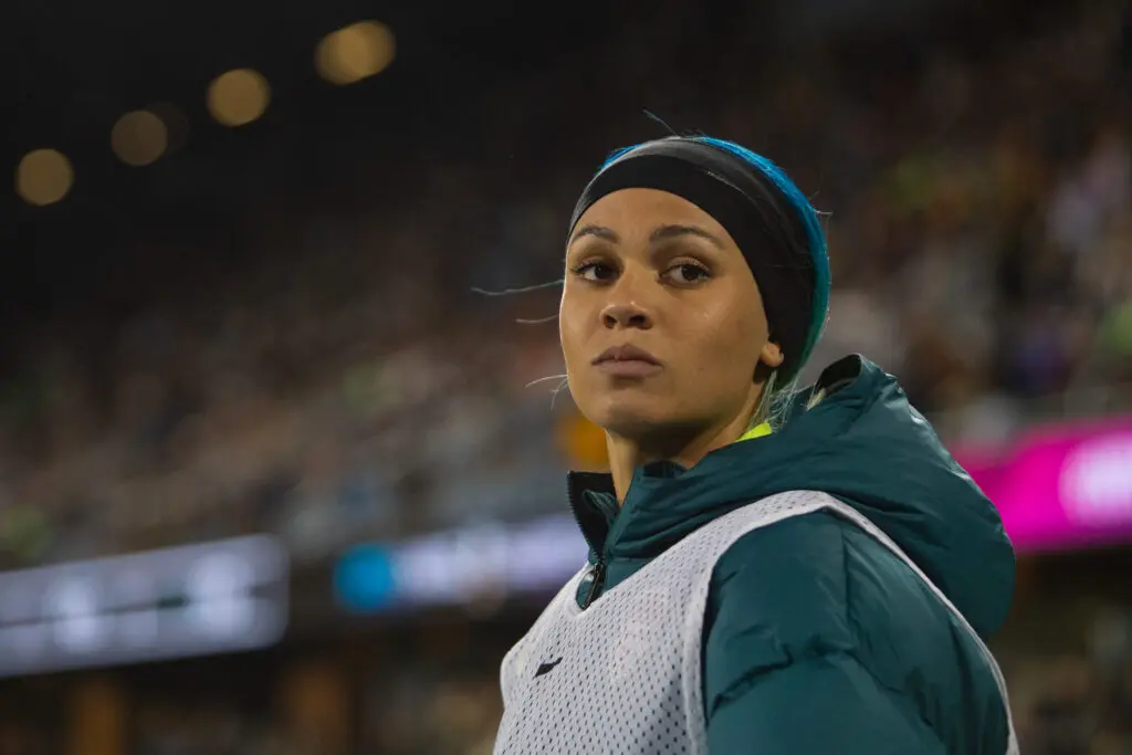 Washington Spirit star Trinity Rodman looks on from the sideline during the 2025 NWSL Championship match.