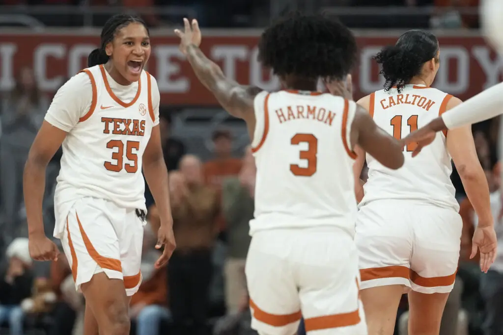 Texas forward Madison Booker reacts to a play with guard Rori Harmon during a 2025/26 NCAA basketball game.