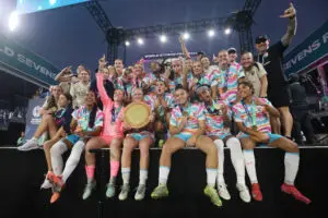 San Diego Wave players and staff lift their 2025 W7F trophy after winning the 7v7 soccer venture's first-ever North American tournament.