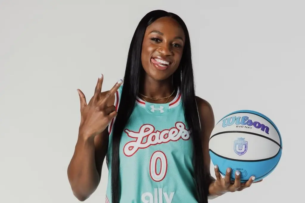 Laces BC guard Jackie Young poses holding a basketball during an Unrivaled photo shoot.