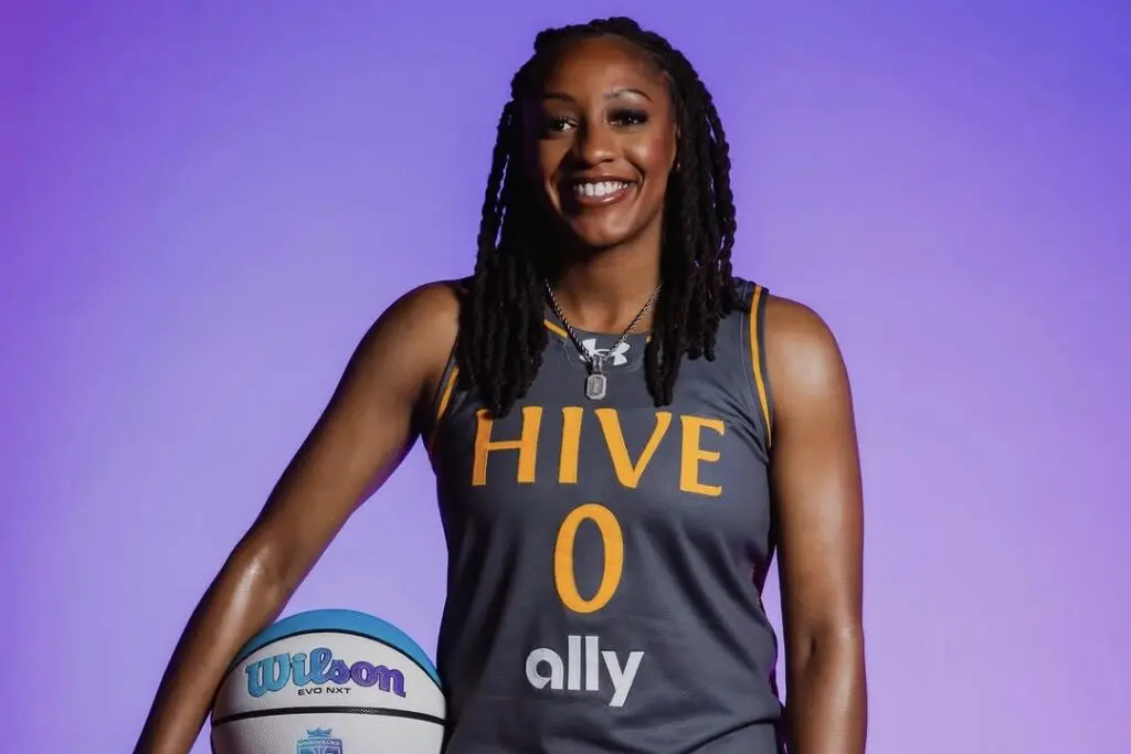 Hive BC's Kelsey Mitchells poses holding a basketball on her hip during an Unrivaled photo shoot.