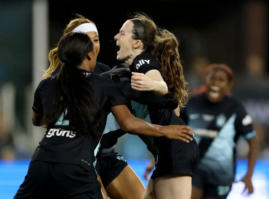 Gotham FC star Rose Lavelle celebrates her title-winning goal with teammates Midge Purce and Jaedyn Shaw during the 2025 NWSL Championship match.