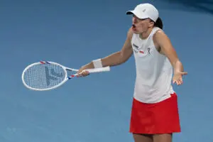 Poland tennis star Iga Świątek reacts to a play during a 2026 United Cup match.