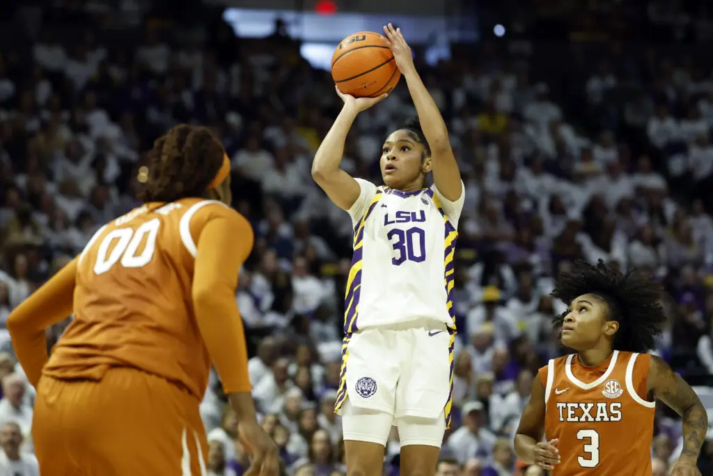 LSU sophomore guard Jada Richard puts up a shot as Texas guard Rori Harmon looks on during a 2025/26 NCAA basketball game.