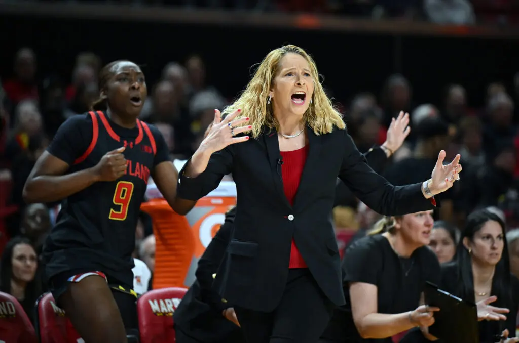 Maryland head coach Brenda Frese and forward Isimenme Ozzy-Momodu react to a call during a 2025/26 NCAA basketball game.