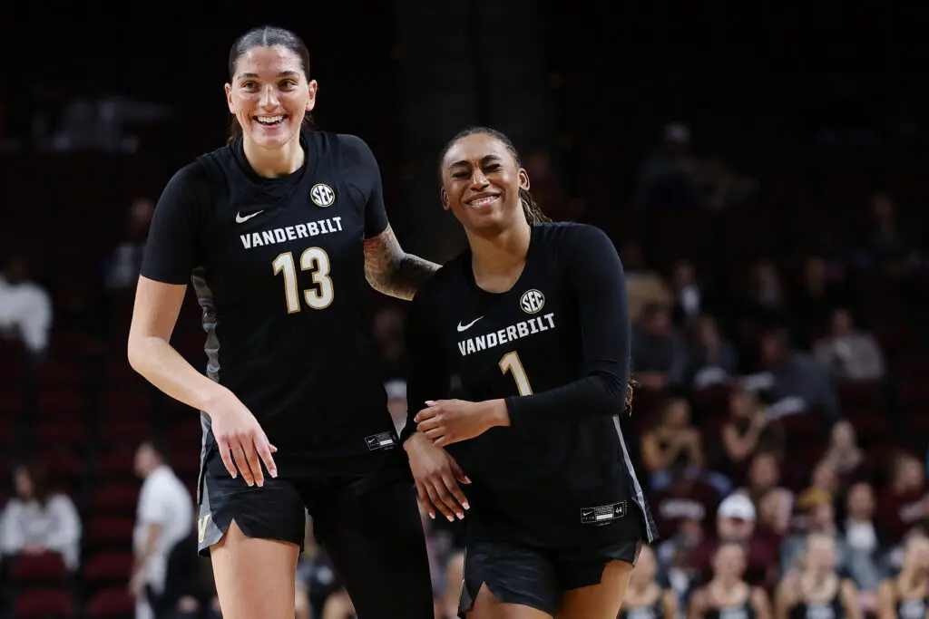 Vanderbilt senior Justine Pissott and sophomore Mikayla Blakes laugh at a play during a 2025/26 NCAA basketball game.