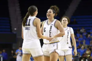 UCLA guards Gabi Jaquez and Charlisse Leger-Walker celebrate a play during a 2025/26 NCAA basketball game.