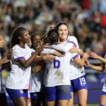 USWNT attacker Emma Sears hugs goalscorer Emily Sams during a 2026 friendly against Chile.