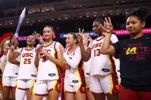 zy Davidson #9, Brooklyn Shamblin #24, Dayana Mendes #13 and Malia Samuels #10 of the USC Trojans celebrate after the iowa vs usc game against Iowa women's basketball at Galen Center on January 29, 2026 in Los Angeles, California.