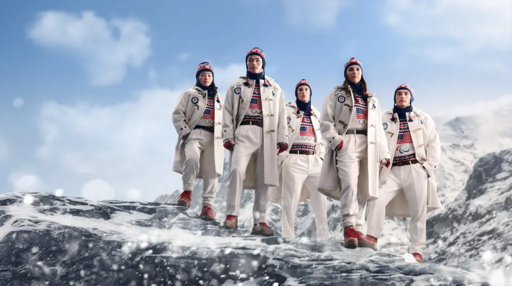 A graphic of models in the Team USA opening ceremony outfit for the 2026 Winter Olympics standing on an icy mountaintop.