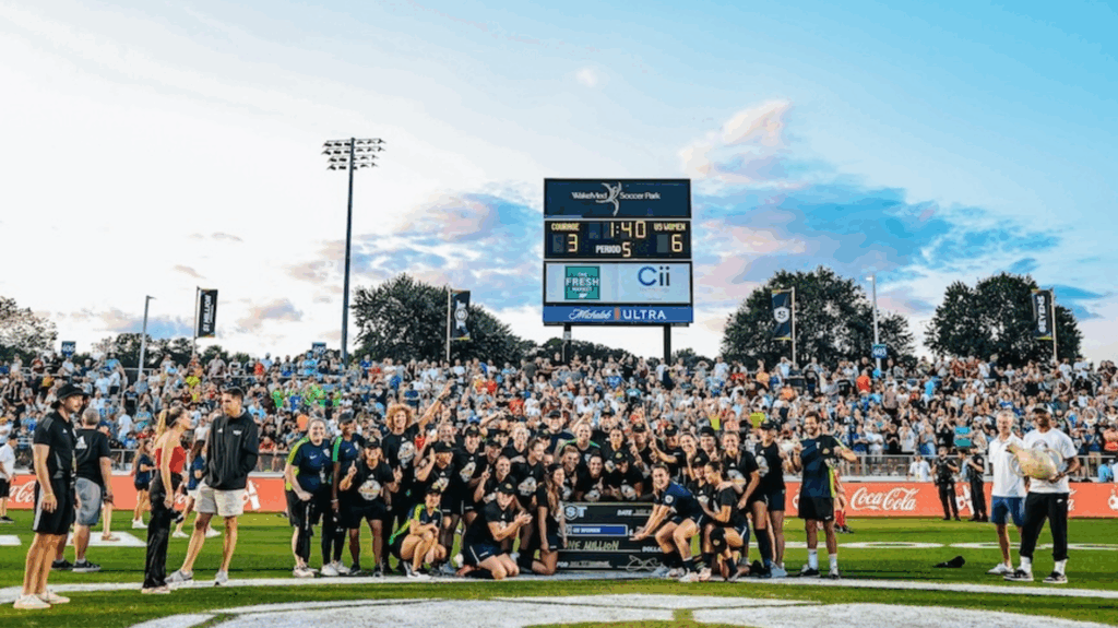 The 2025 TST champion US Women pose with their $1 million winners' check on the pitch at WakeMed Soccer Park in Cary, North Carolina.