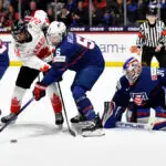 Megan Keller #5 of United States defends against Natalie Spooner #24 of Canada as she tries to deflect the puck past Aerin Frankel #31 of United States in the 1p during the 2024 IIHF Women's World Championship Gold Medal game at Adirondack Bank Center on April 14, 2024 in Utica, New York.