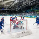 Team USA women's hockey battles Team Czechia on the ice in their first game at the 2026 Winter Olympics.