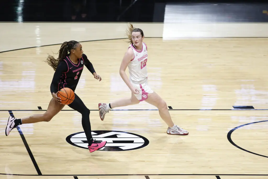 Vanderbilt guard Mikayla Blakes drives around Oklahoma guard Payton Verhulst during a 2025/26 NCAA basketball game.