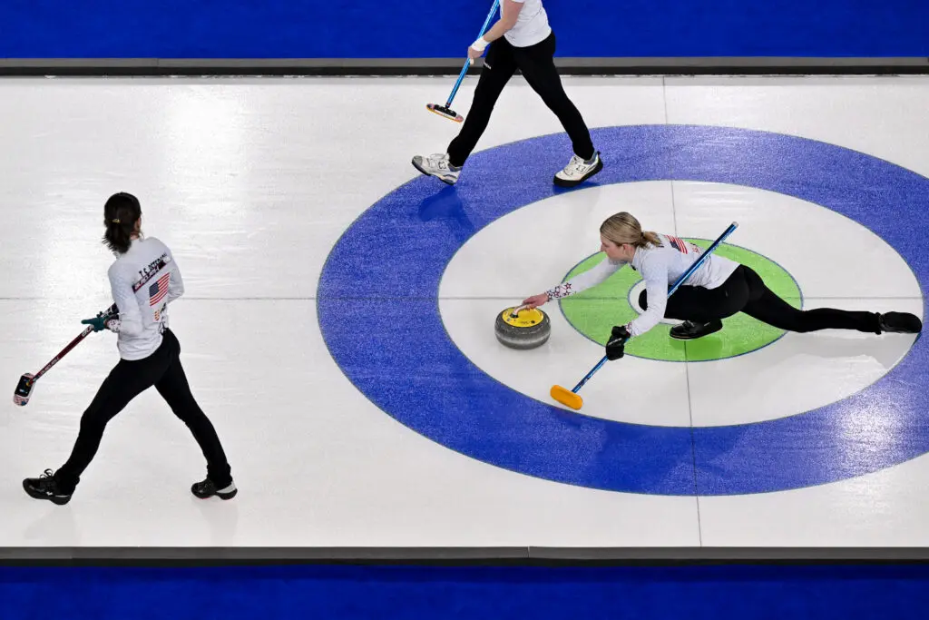 USA curlers Tabitha Peterson and Cory Thiesse compete in a 2026 Winter Olympics round-robin matchup with Denmark.