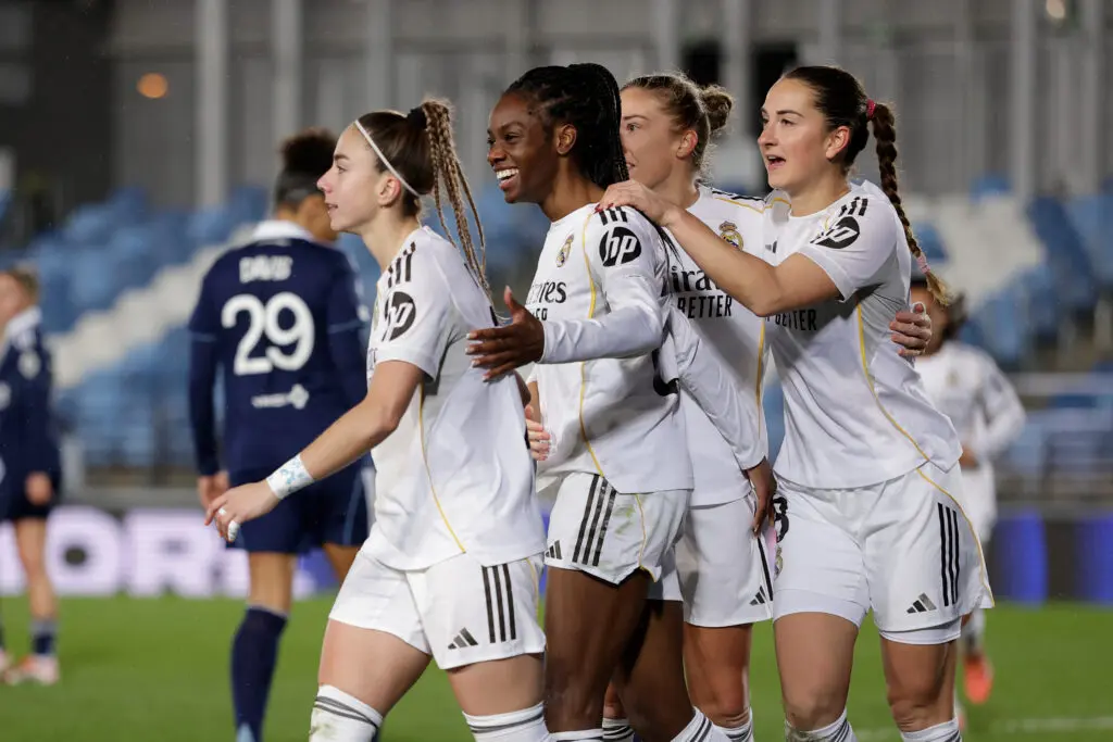 Real Madrid winger Athenea, forward Naomie Feller, and midfielder Sara Däbritz celebrate a goal during a 2025/26 UEFA Champions League Round of 16 match.
