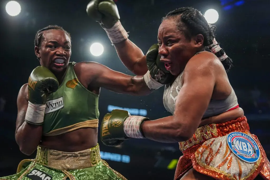 Claressa Shields, left, throws a punch against Franchón Crews-Dezurn during the Female Heavyweight World Title bout at Little Caesar’s Arena in Detroit on Sunday, February 22, 2026.