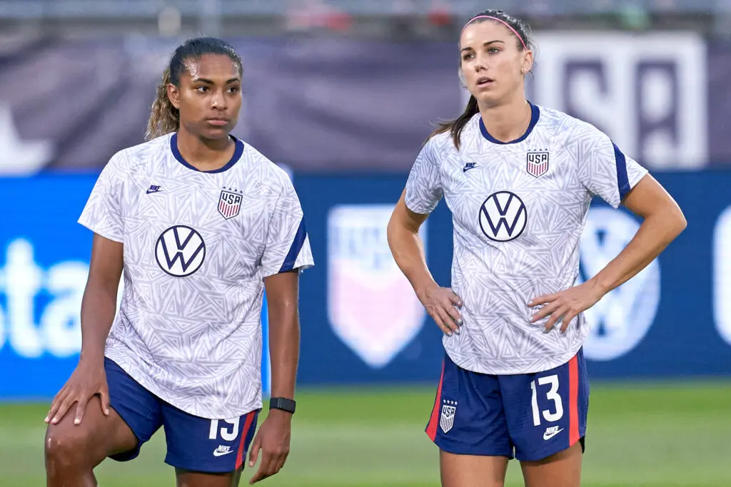USWNT and San Diego Wave forward Catarina Macario (19) and forward Alex Morgan (13) look on during warmups prior to action during a friendly match between USA and Mexico on July 01, 2021, at Pratt & Whitney Stadium at Rentschler Field, in East Hartford, CT.