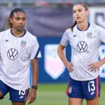 USWNT and San Diego Wave forward Catarina Macario (19) and forward Alex Morgan (13) look on during warmups prior to action during a friendly match between USA and Mexico on July 01, 2021, at Pratt & Whitney Stadium at Rentschler Field, in East Hartford, CT.