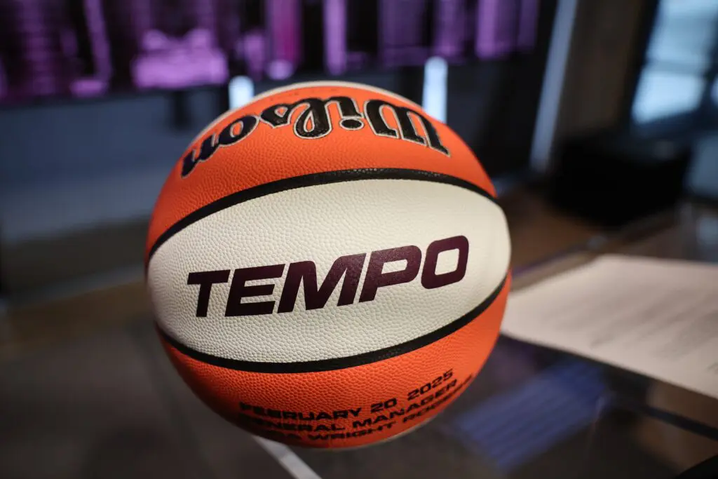 A close-up of a ceremonial basketball reading "Tempo" in honor of the 2026 WNBA expansion team in Toronto.