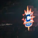 The logos for the Connecticut Sun and their Uncasville home at Mohegan Sun Arena are displayed before a 2025 WNBA game.