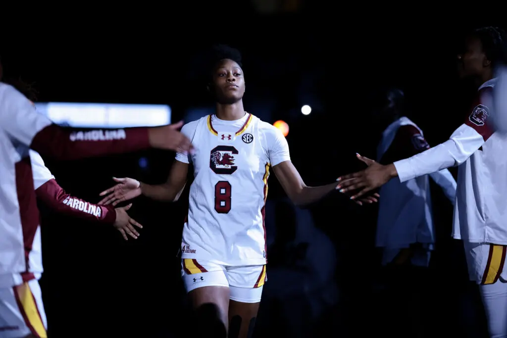South Carolina forward Joyce Edwards high-fives her teammates as she's introduced before a 2025/26 NCAA basketball game.