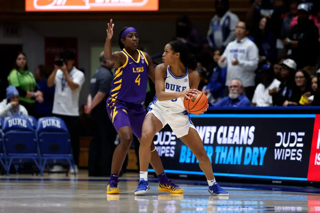LSU guard Flau'jae Johnson defends as Duke guard Ashlon Jackson looks to pass the basketball during a 2025/26 NCAA game.