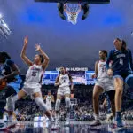 MD Ntambue #3 and Kylee Watson #4 of the Villanova Wildcats are defended by Azzi Fudd #35 and Sarah Strong #21 of the UConn basketball Huskies during the second half of an NCAA women's basketball game at Harry A. Gampel Pavilion on January 15, 2026 in Storrs, Connecticut.