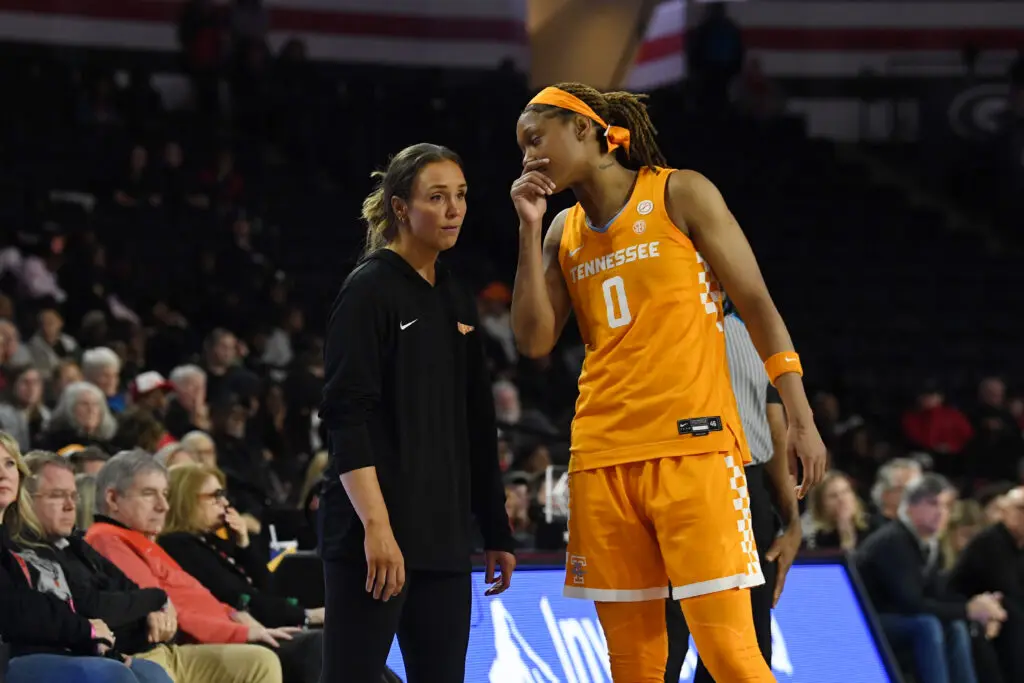 Tennessee head coach Kim Caldwell talks to forward Janiah Barker during a 2025/26 NCAA women's basketball game.