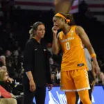 Tennessee head coach Kim Caldwell talks to forward Janiah Barker during a 2025/26 NCAA women's basketball game.