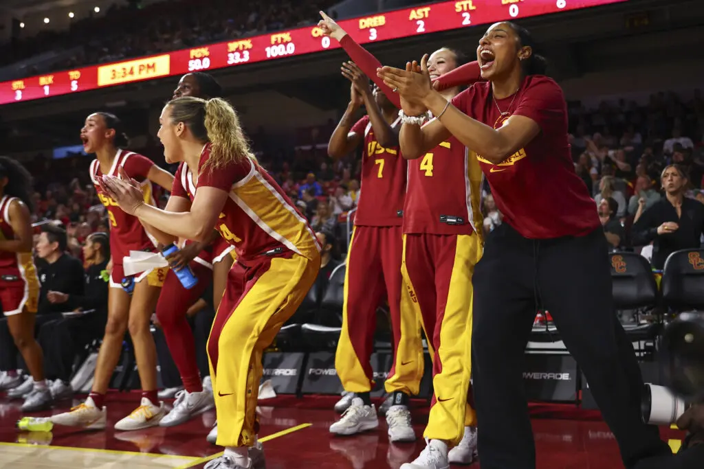 The USC women's basketball bench celebrates a play during a 2025/26 NCAA game.