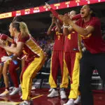 The USC women's basketball bench celebrates a play during a 2025/26 NCAA game.