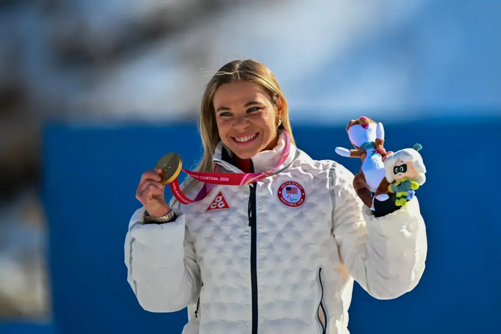 Team USA star Oksana Masters celebrates her gold medal in the sprint sitting biathlon at the 2026 Winter Paralympics.